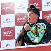 John McGuinness celebrates winning the Classic TT Senior race in 2019, his most recent victory around the Mountain Course.