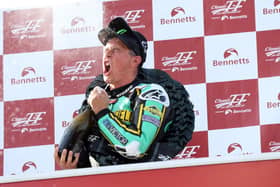 John McGuinness celebrates winning the Classic TT Senior race in 2019, his most recent victory around the Mountain Course.