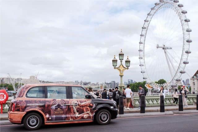 The London cabs with the distinctive The Sexton graphic