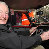 Paddy Hopkirk in the driving seat of a 1964 Mini in 2014