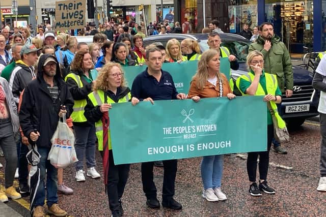 People take part in a demonstration in Belfast calling for action from government to support those battling addiction issues following 15 drugs related deaths in the city since the start of June