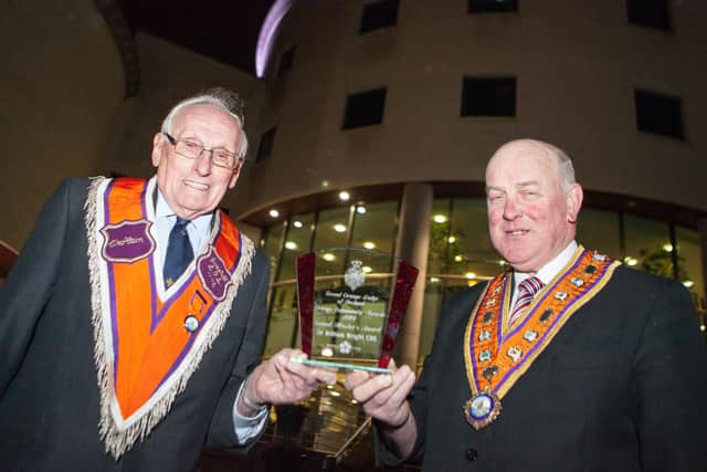 William Wright receives the Grand Master’s Award in 2015 from the Grand Master of the Grand Orange Lodge of Ireland, Edward Stevenson