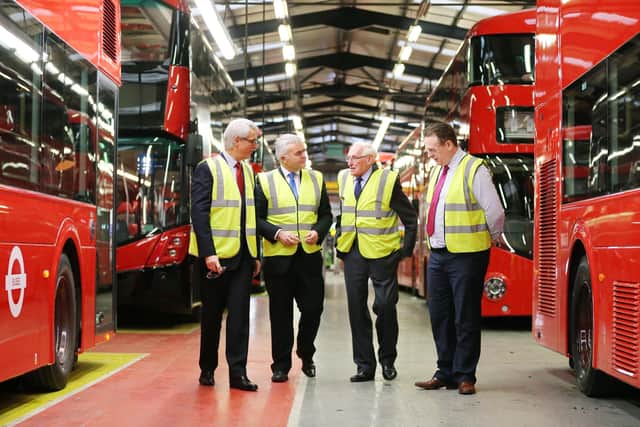 Trade and Investment Minister Jonathan Bell is pictured at Ballymena bus builder Wrightbus in 2015 with Mark Nodder (Wrightbus), William Wright (Wrightbus) and Steven Francey (Wrightbus).

Picture by Kelvin Boyes / Press Eye
