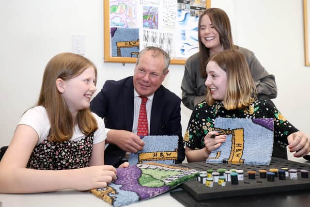 Jubilee design competition winner Emily McMullan with Minister Conor Burns and Ulster Carpets designers Sarah Healy and Sinead Tumilty