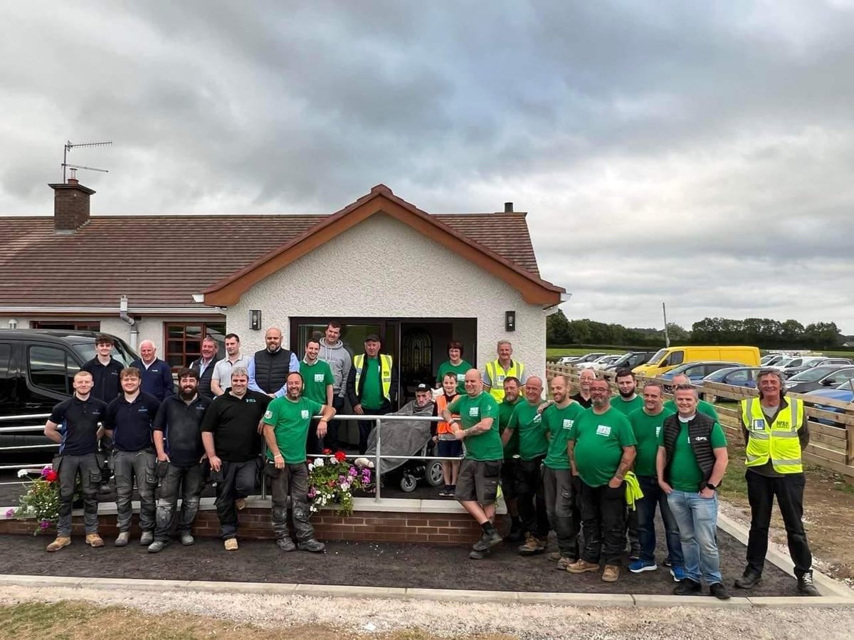 NI volunteer builders help bed-bound father of six get a view of his garden