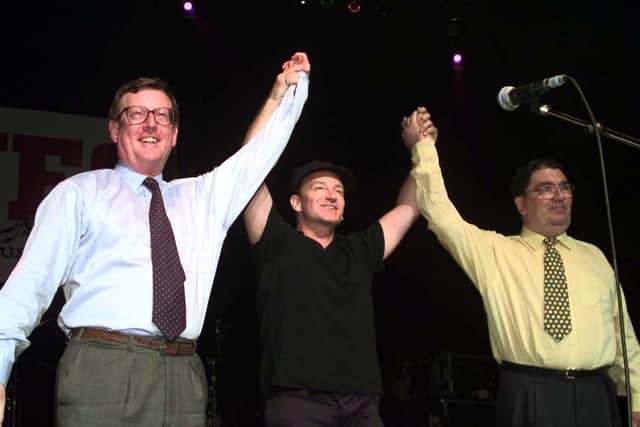 U2 rock star is flanked by UUP leader David Trimble (left) and SDLP leader John Hume on stage during a special concert in Belfast to promote the "Yes" vote in the peace referendum in Northern Ireland. The former Northern Ireland first minister has died, the Ulster Unionist Party has announced