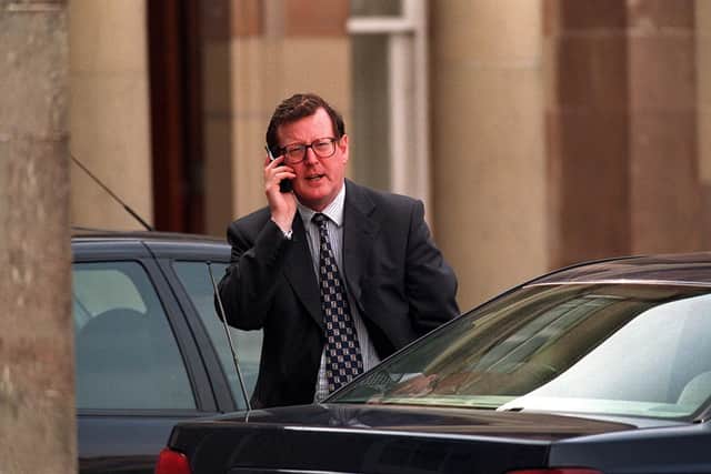 Ulster Unionist leader David Trimble takes a break during a marathon 20 hour talks session at Hillsborough in 1999 to make a phone call. 
PICTURE BY STEPHEN DAVISON/PACEMAKER