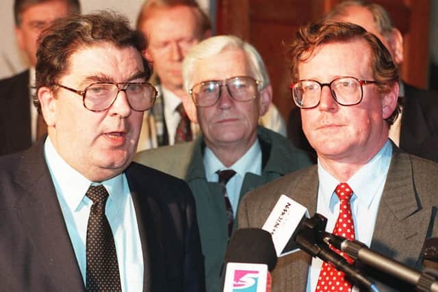 The late John Hume, leader of the SDLP, talking to journalists with Ulster Unionist leader David Trimble
