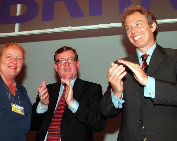 Northern Ireland Secretary Mo Mowlam, Northern Ireland First Minister David Trimble and British Prime Minister Tony Blair on the platform during the Labour Party conference in Blackpool