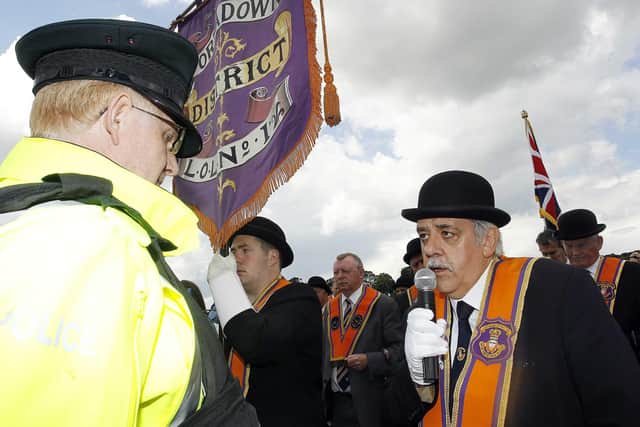 Portadown District secretary David Jones addresses a PSNI inspector at Drumcree Church as they take part in the annual Drumcree parade protest in 2014.
Photo: Aidan O'Reilly/Pacemaker Press