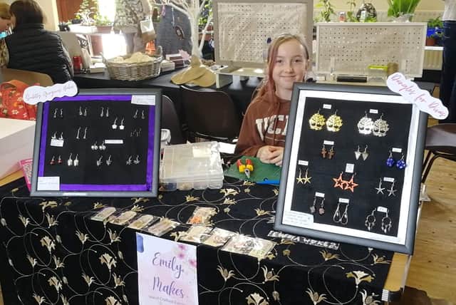 Emily HIrsk selling her creations at a craft fair