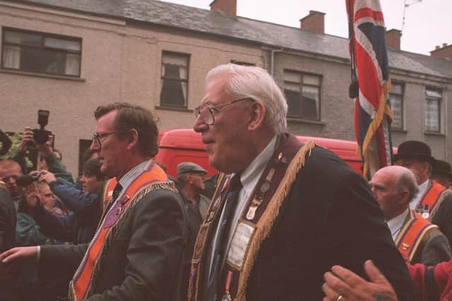 David Trimble (left) and Rev Ian Paisley join the Orange Drumcree parade at the end of the Garvaghy Road in July 1995. Photo: Pacemaker Belfast