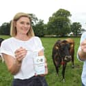 Pictured here are Nichola Lockhart, CEO of Ards Business Hub with Clandeboye Estate Yoghurt general manager Bryan Boggs and Cookie the cow