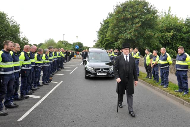 PACEMAKER PRESS 27/07/2022
Wrightbus staff form Guard of Honour in tribute to founder Sir William Wright

Hundreds of Wrightbus employees formed a guard of honour outside the Ballymena factory in tribute to Sir William Wright, whose funeral was today (WEDS 27 JULY).

Management and factory staff joined forces in huge numbers to pay their respects as Sir William's funeral cortege passed by.