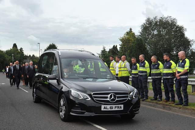 Management and staff stood together to pay their respects as Sir William’s funeral cortege passed by on Wednesday