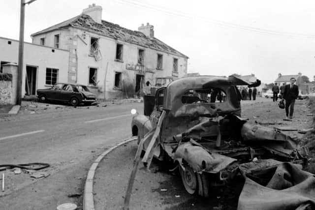 the scene outside the Beavpont Arms, in the Co Londonderry village of Claudy on July 31, 1972, after three car bombs exploded killing nine people
