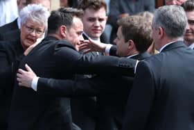 Declan Donnelly (right) is embraced by his stage partner Ant McPartlin (left) outside St Mary's Cathedral, Newcastle, following a Requiem Mass for his brother Father Dermott Donnelly, who died aged 55 after a sudden illness earlier this month. Picture date: Friday July 29, 2022. Picture: Scott Heppell/PA Wire