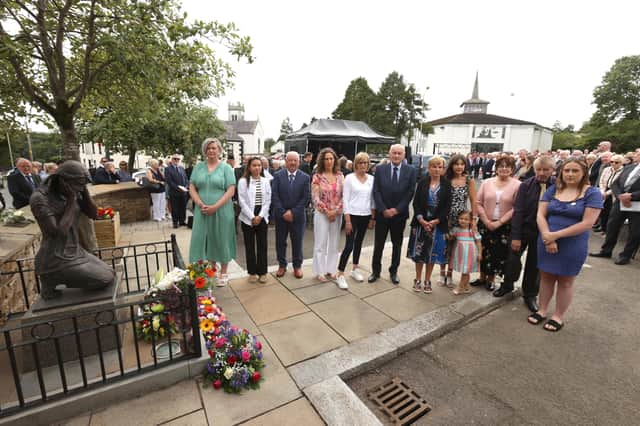 Bombing victim family members at a service in Claudy, Co Londonderry, to commemorate the nine people killed in three bomb blasts in the town in 1972. Photo: Liam McBurney/PA