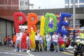 People during Belfast Pride parade which returns to the city for the first time since the pandemic. Picture date: Saturday July 30, 2022.