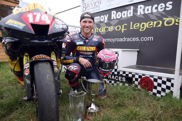 Davey Todd celebrates his victory in the 'Race of Legends' at the Armoy Road Races on Saturday.