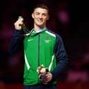 Northern Ireland's Rhys McClenaghan receives his silver medal during the ceremony for the Men's Pommel Horse Final at Arena Birmingham on day four of the 2022 Commonwealth Games