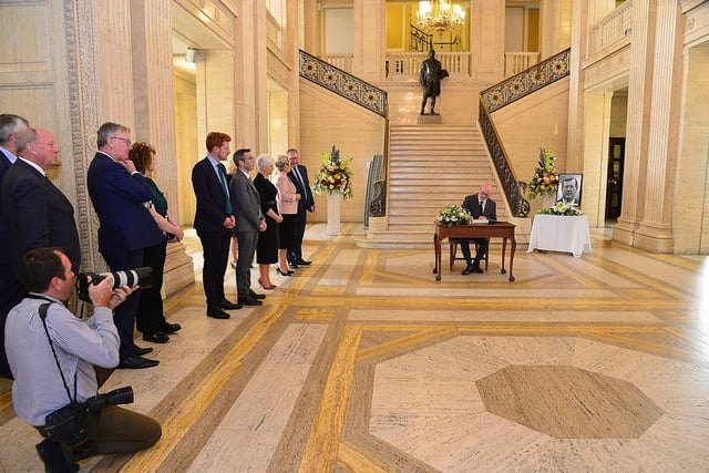 Signing the book of condolences at Stormont
