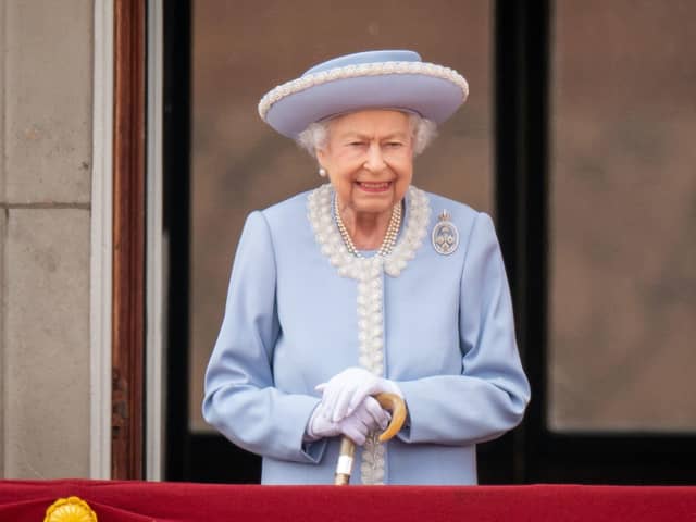 Queen Elizabeth II watching the Royal Procession from the balcony at Buckingham Palace following the Trooping the Colour ceremony in June this year. Photo: PA/Wire