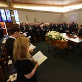 The service for Trimble. His family are to the left, politicians including Boris Johnson and Micheal Martin in the perpendicular, facing row