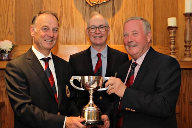Ashley Moore, Sir Richard McLaughlin, Deric Henderson with the trophy