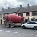 Handout photo of the scene in Main Street, Pomeroy, Co Tyrone, after a cement mixer lorry crashed into a house. Police and the Northern Ireland Fire and Rescue Service (NIFRS) attended the scene. A man was rescued from a first-floor flat in an adjacent property by the NIFRS following the crash. Local Sinn Fein councillor Cathal Mallaghan told PA the crash had caused substantial damage to the building