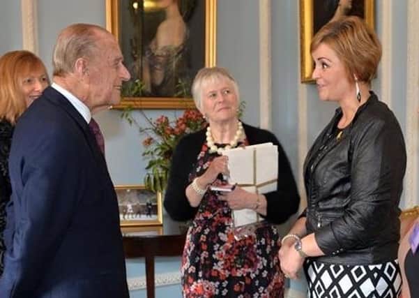U105 presenter and sports journalist Denise Watson meeting Prince Philip at Hillsborough Castle in 2015. Photo: Aaron McCracken/Harrisons