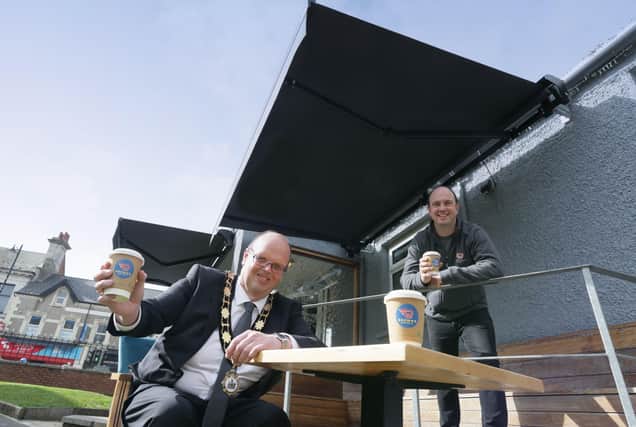 Mayor of Antrim and Newtownabbey, Councillor Jim Montgomery with Daniel Brown from Browns Coffee, Ballyclare, who recently benefitted from the installation of an awning to his business premises