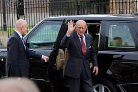 Prince Philip waves to well-wishes at the Crumlin Road Jail
 in June 2014. Picture - Kevin Scott / Presseye