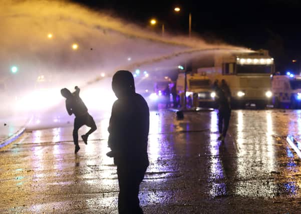 PACEMAKER, BELFAST, 8/4/2021: Nationalist rioters are doused by the PSNI's water cannon during fighting on the Springfield Road, Belfast on Thursday night.
 Whilst much of the rioting has been loyalist in nature, in recent nights republican youths in interface areas have been getting involved more heavily.
