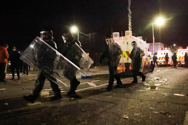 Police in riot gear in north Belfast on Friday night. 

Photo by Kelvin Boyes  / Press Eye.