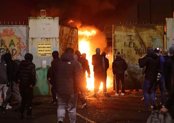 Rioters last week at the peace gates in Lanark Way in west Belfast, which were forced open. Picture Pacemaker