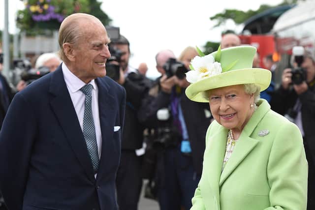 Queen Elizabeth II and Prince Philip, Duke Of Edinburgh arrive by steam train to open the new Bellarena Station village on June 28, 2016 in Bellarena, Northern Ireland.  (Photo by Carrie Davenport/Getty Images)