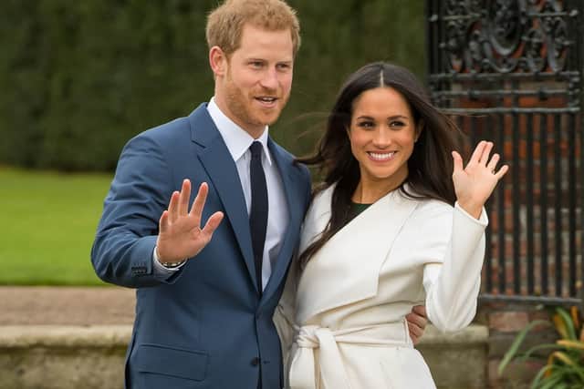 File photo dated 27/11/17 of Prince Harry and Meghan Markle in the Sunken Garden at Kensington Palace, London, after the announcement of their engagement