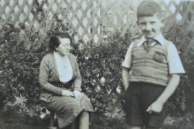 Kenneth Bloomfield, who was an only child, photographed with his mother Doris. They sheltered under the stairs at home in East Belfast during the 1941 Nazi raids