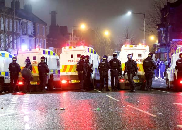 PSNI riot squad officers try to keep nationalist and loyalists apart at Lanark Way interface in west Belfast last week. Dr Dingley writes: "It is completely wrong that loyalists take it out on PSNI but the authorities should charge law-breaking politicians"