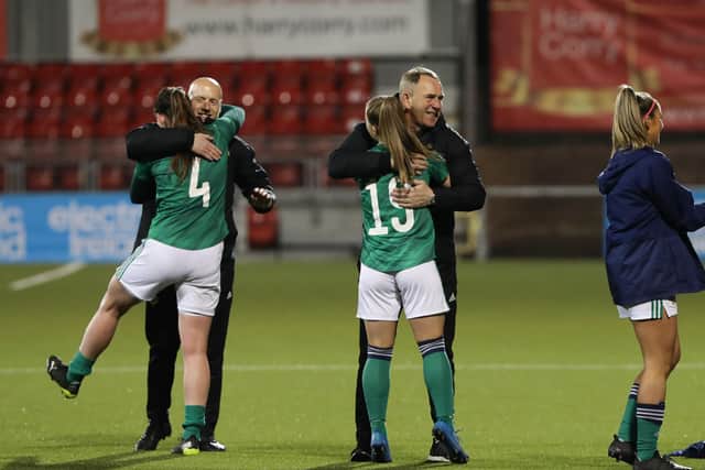 Northern Ireland women's team manager Kenny Shiels (centre) celebrates on Tuesday evening.