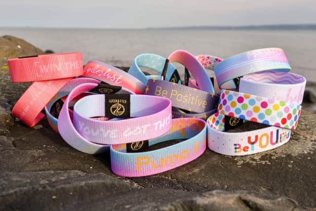 Some of the many motivational wristbands available from Ozz Bands