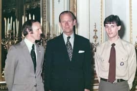 Donald and Stephen McBride, the first father and son to
receive the Gold Duke of Edinburgh Award, with Prince Philip at Buckingham Palace in 1981.
