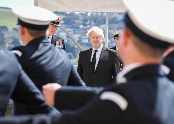 Boris Johnson at passing-out parade, Britannia Royal Naval College, Dartmouth yesterday. Only he can get damages for Libya-IRA victims