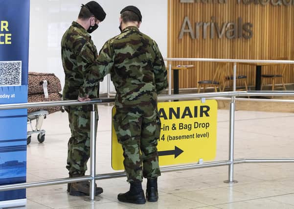 Members of the defence forces in Terminal 1 arrivals hall at Dublin Airport as the StateÕs mandatory quarantine system was extended on Thursday to include the US, Belgium, France and Italy. Picture date: Thursday April 15, 2021. See PA story IRISH Coronavirus. PA Photo. Photo credit should read: Brian Lawless/PA Wire