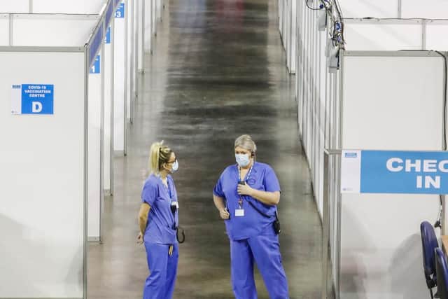 Nurses pictured inside the SSE Arena, Belfast, which is being used by the Department of Health as a mass vaccination centre.