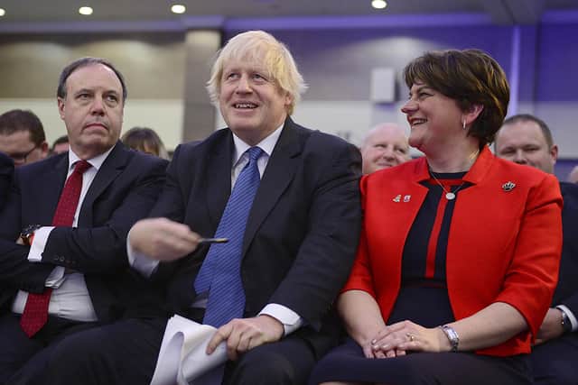 Boris Johnson flanked by Nigel Dodds and Arlene Foster at the DUP conference in November 2018