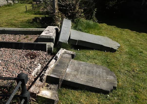 Damage to gravestones in the Jewish section of Belfast's City Cemetery.
 About 10 graves in the cemetery on the Falls Road in west Belfast were damaged on Thursday evening. Police said the incident is being investigated as a hate crime. Photo by Kelvin Boyes  / Press Eye.