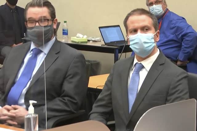 In this image from video, defense attorney Eric Nelson, left, and defendant, former Minneapolis police Officer Derek Chauvin, arrive for the verdict in Chauvin's trial for the 2020 death of George Floyd