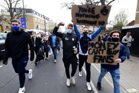 Fans protest against Chelsea’s involvement in the new European Super League outside Stamford Bridge last night